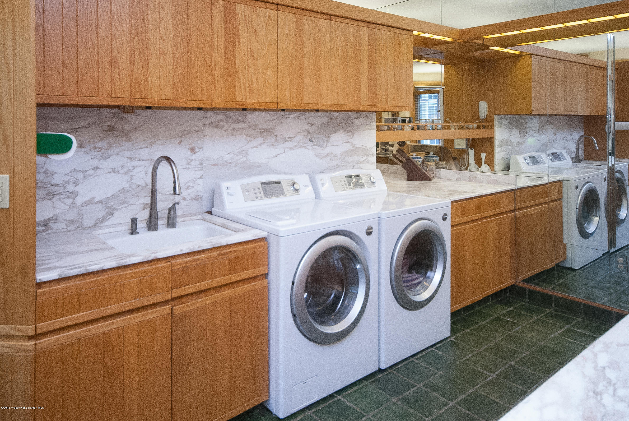 145 Carbondale Road Waverly, PA 18471 - Photo 36 of 98 a kitchen with sink a washer and dryer