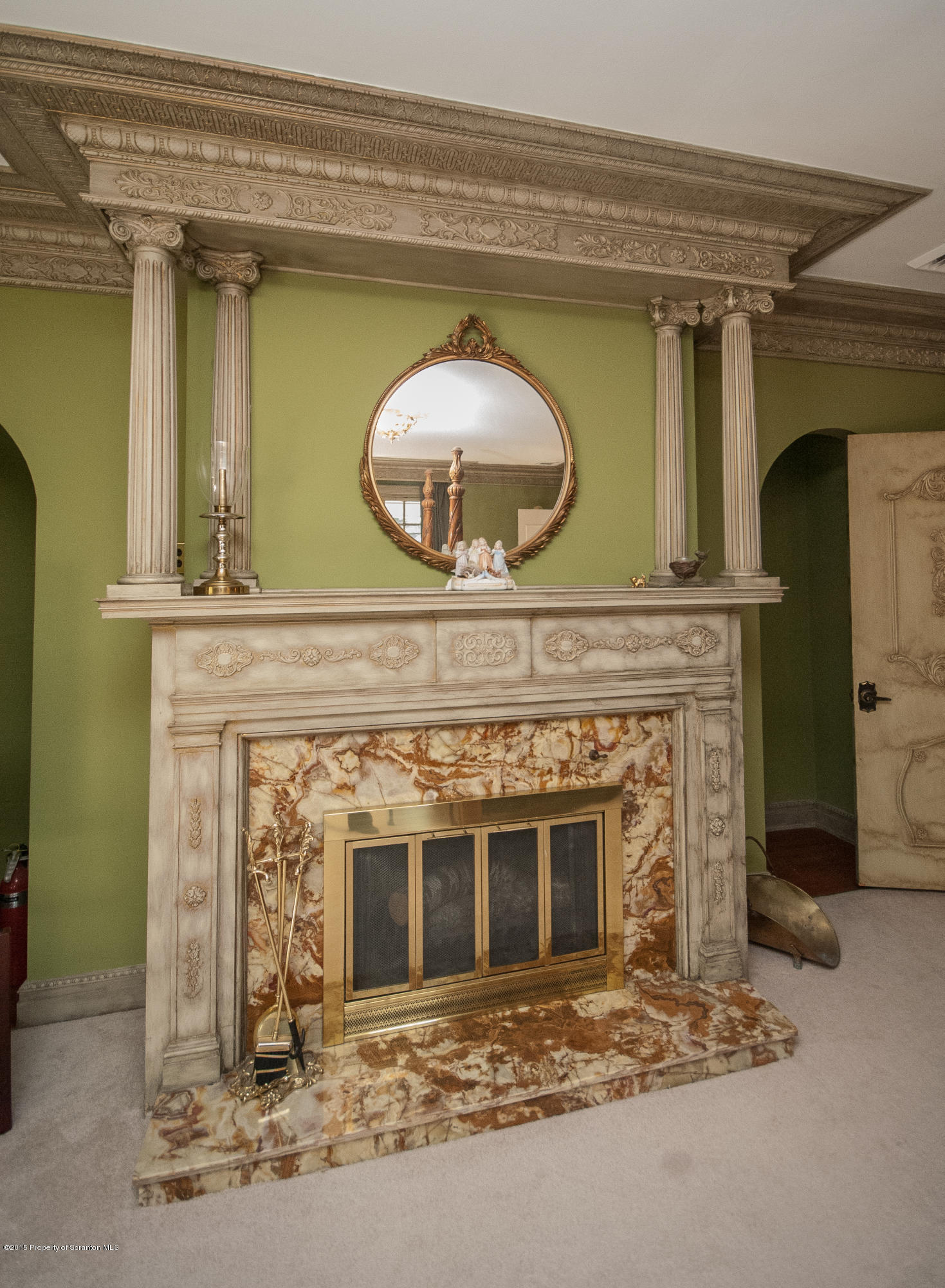 145 Carbondale Road Waverly, PA 18471 - Photo 53 of 98 a view of a livingroom with a fireplace and a chandelier