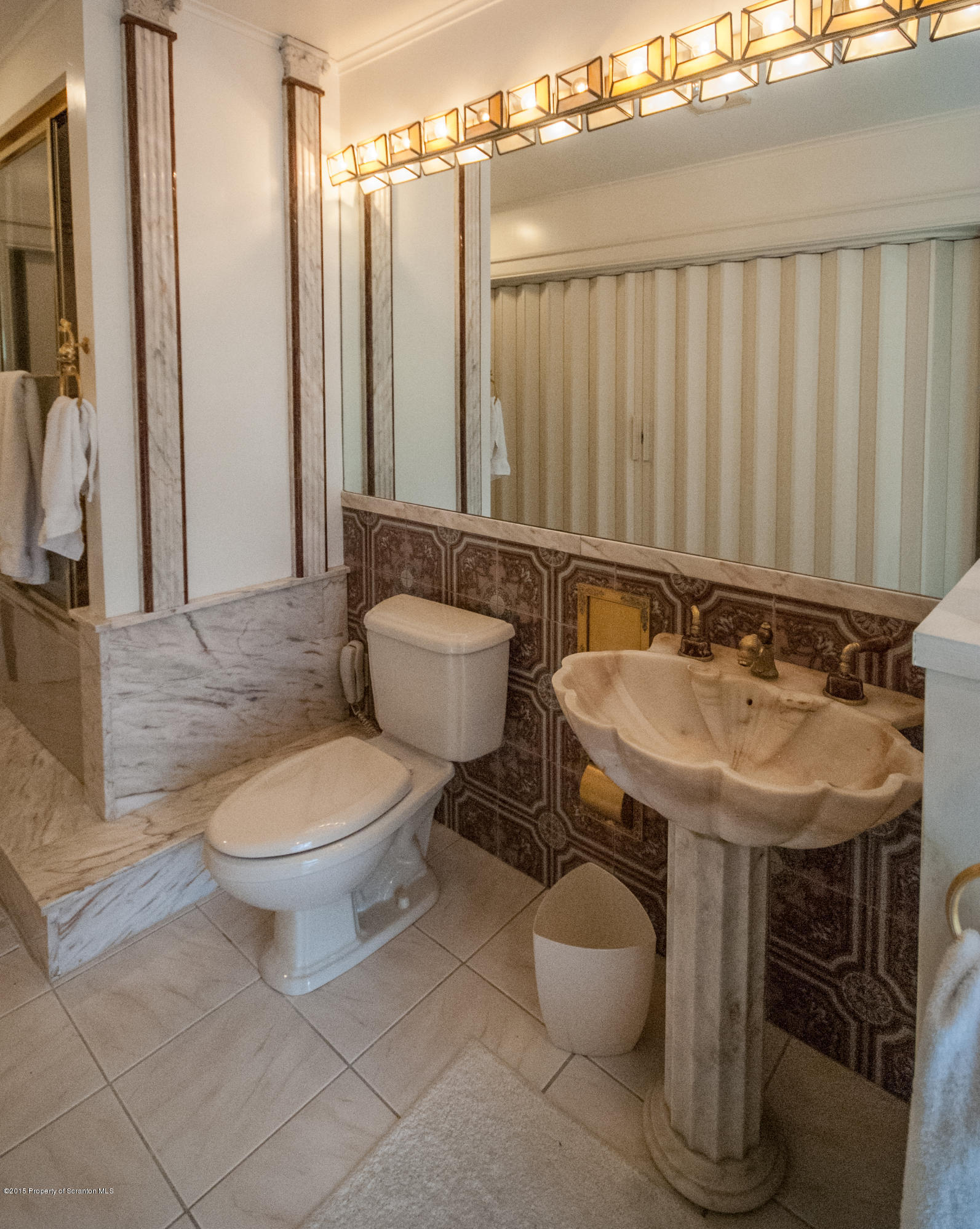 145 Carbondale Road Waverly, PA 18471 - Photo 60 of 98 a bathroom with a toilet sink and mirror