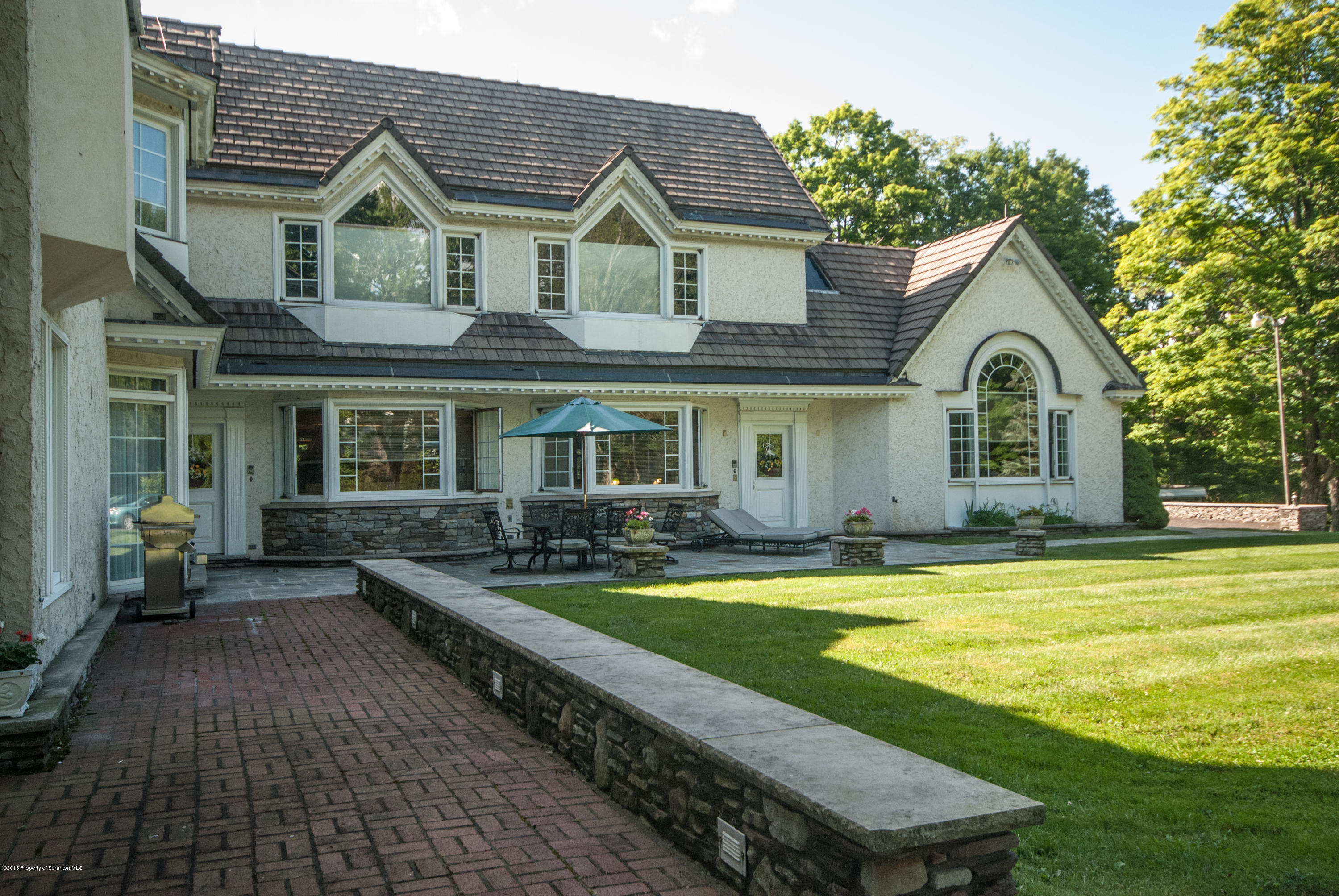 145 Carbondale Road Waverly, PA 18471 - Photo 76 of 98 a front view of a house with swimming pool having outdoor seating