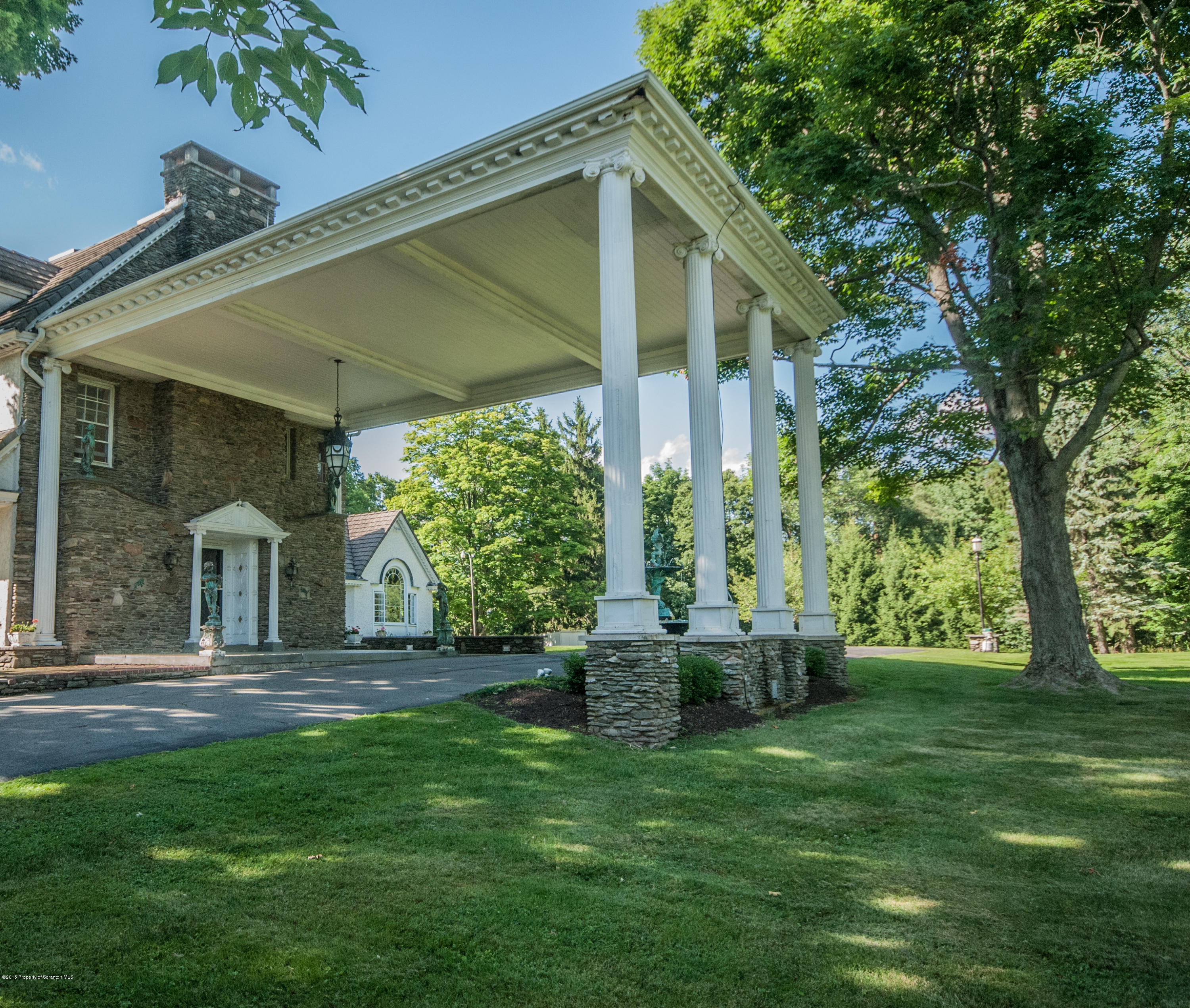 145 Carbondale Road Waverly, PA 18471 - Photo 77 of 98 a front view of a house with a garden