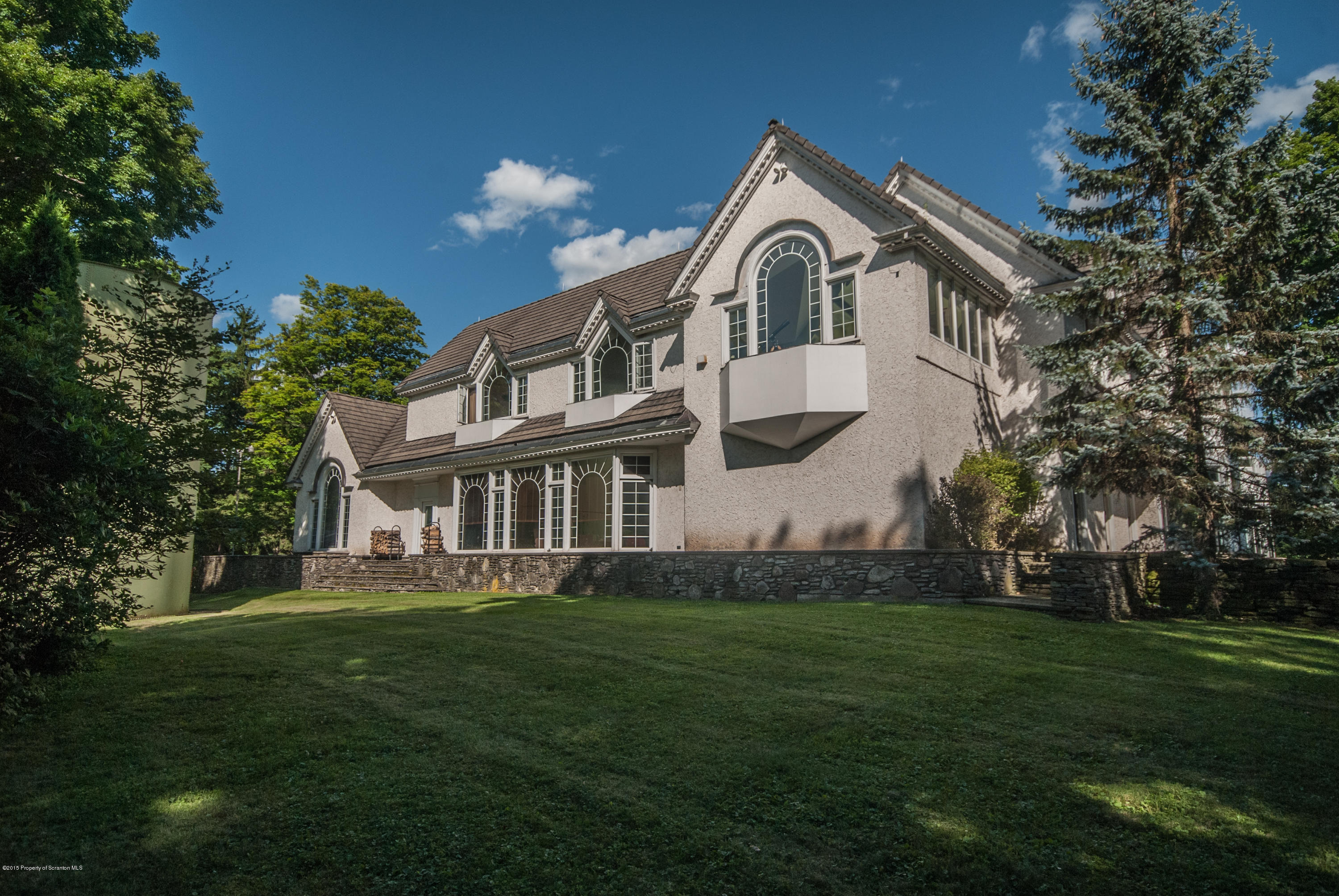 145 Carbondale Road Waverly, PA 18471 - Photo 79 of 98 a front view of a house with a garden