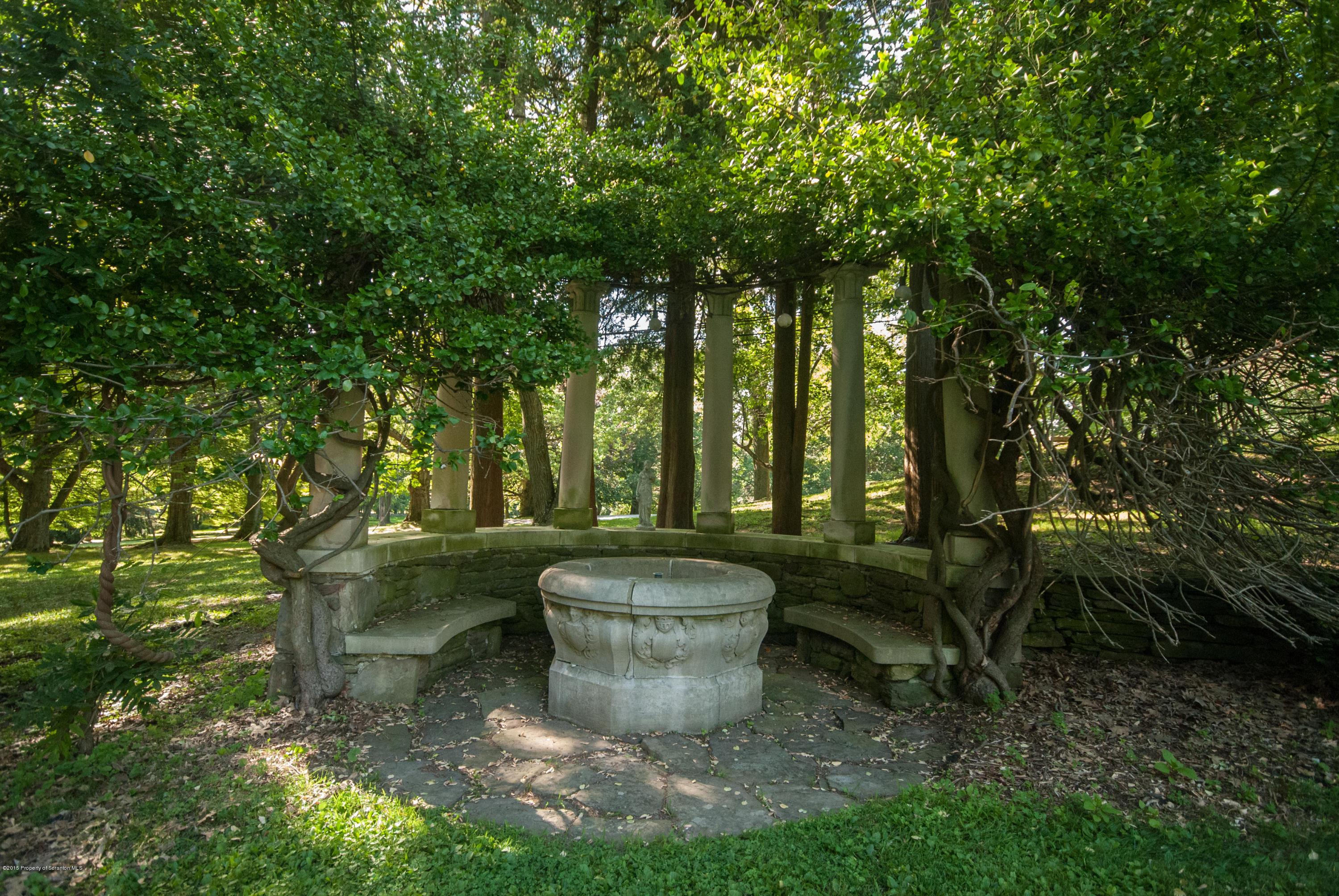 145 Carbondale Road Waverly, PA 18471 - Photo 89 of 98 a view of a backyard with fountain plants and large trees