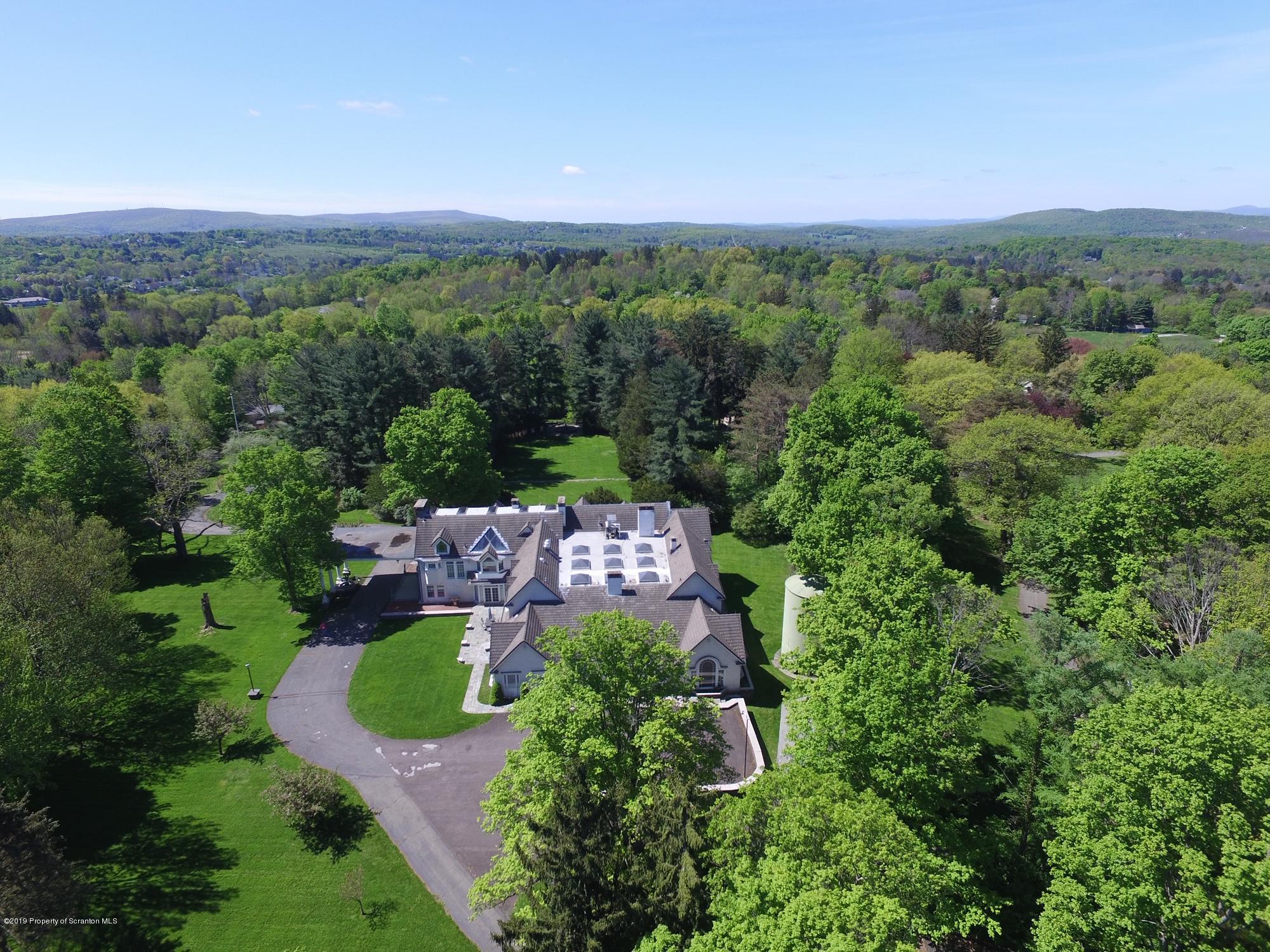 145 Carbondale Road Waverly, PA 18471 - Photo 98 of 98 an aerial view of a house with yard and outdoor seating