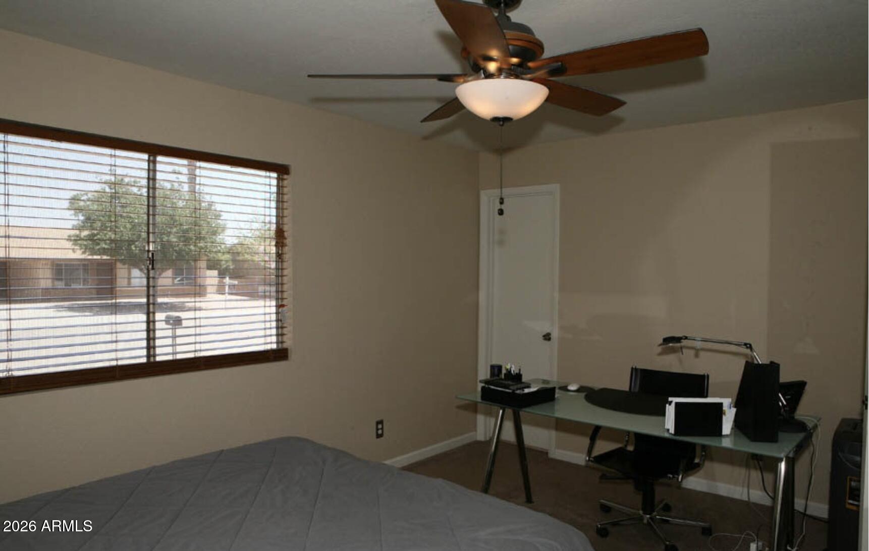 911 West Colgate Drive Tempe, AZ 85283 - Photo 9 of 15 a view of a workspace with furniture and a window