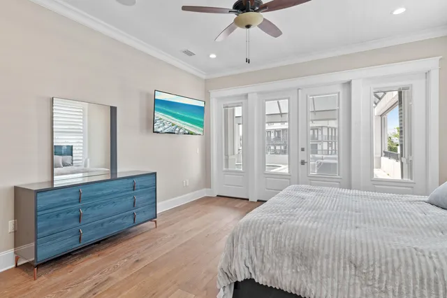 a spacious bedroom with a bed and a dresser