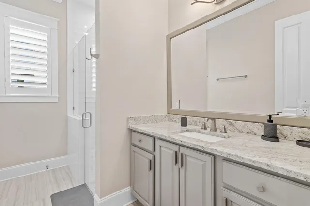 a kitchen with stainless steel appliances granite countertop a sink and a cabinets