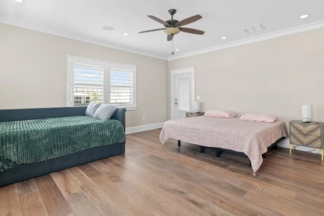 a bathroom with a sink a vanity a large mirror and a shower