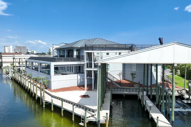 a aerial view of a house with a garden and lake view