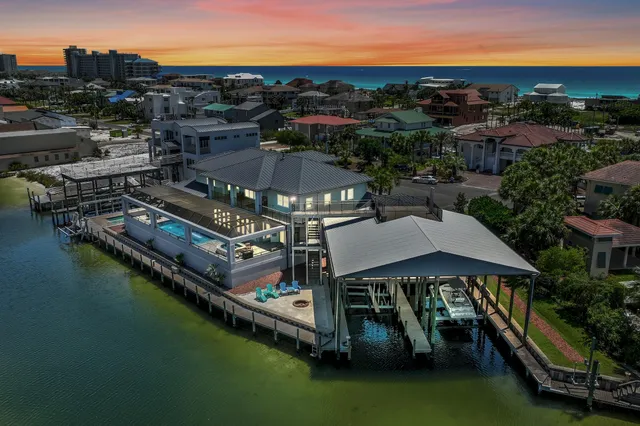a view of a patio with wooden floor and lake view