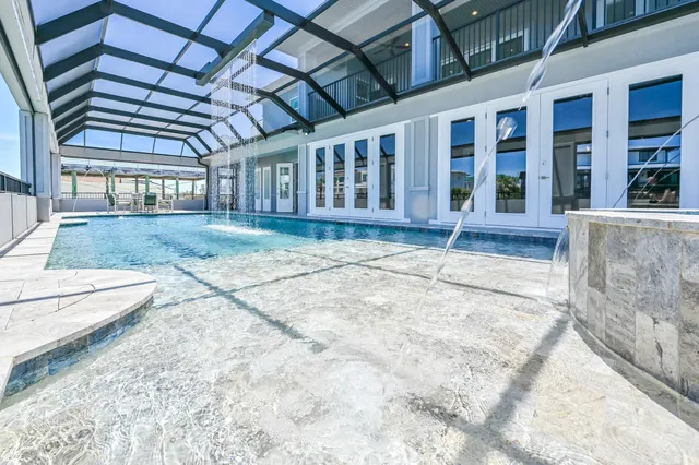 a view of a swimming pool with a outdoor seating