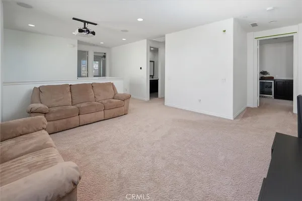 a bedroom with a bed dresser and a window