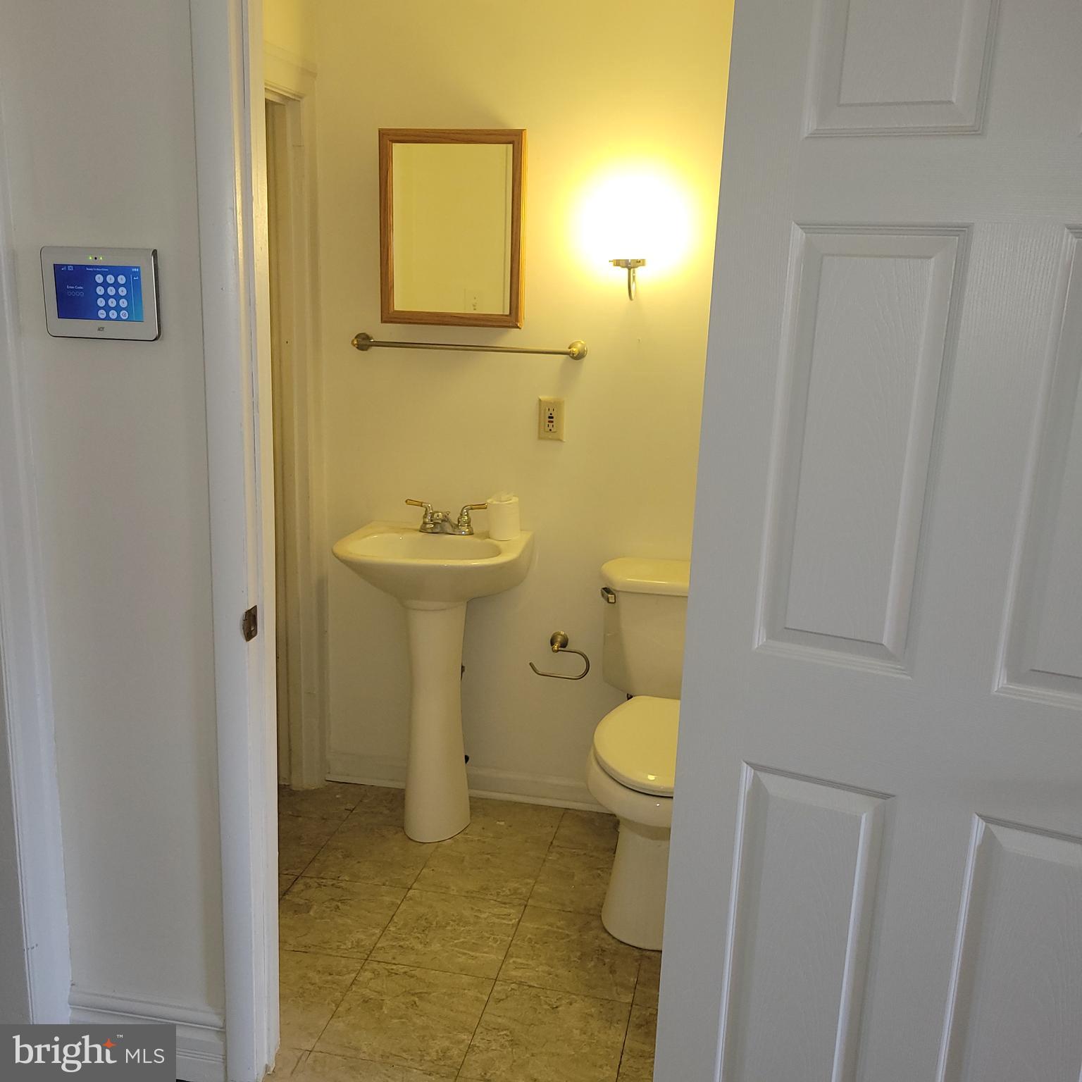 3927 North 17th Street Philadelphia, PA 19140 - Photo 4 of 8 a bathroom with a sink and a toilet
