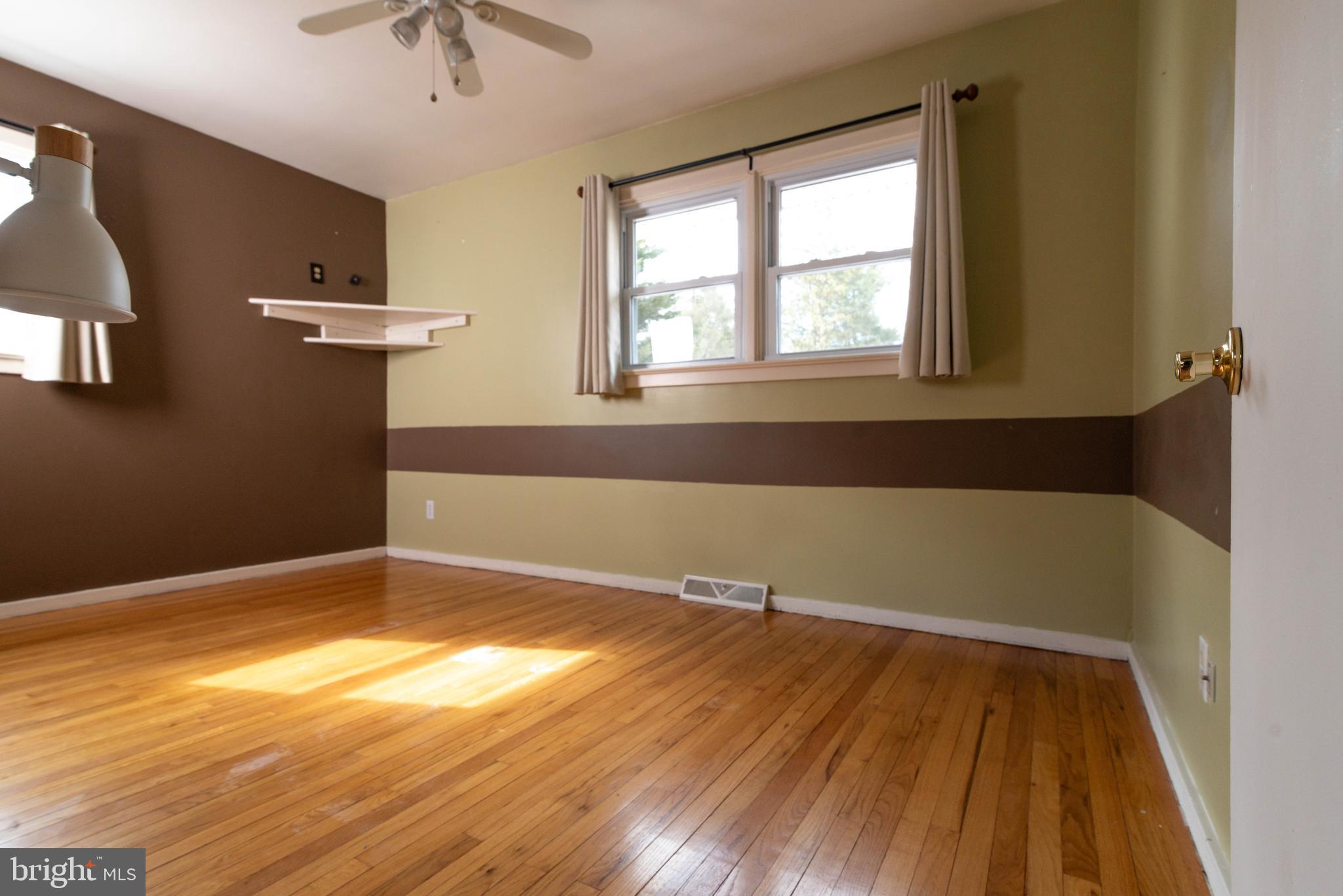 106 South Shady Retreat Road Doylestown, PA 18901 - Photo 11 of 33 wooden floor in an empty room with a window