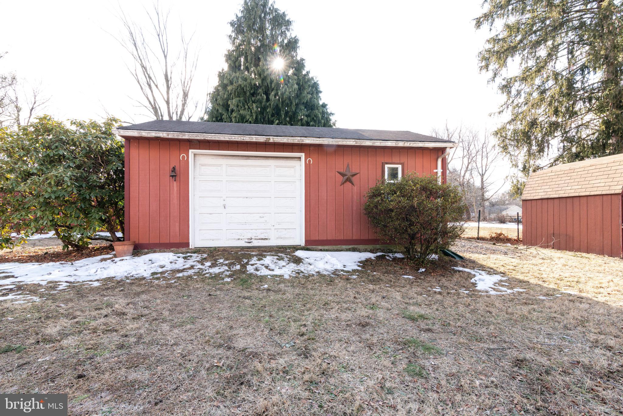 106 South Shady Retreat Road Doylestown, PA 18901 - Photo 24 of 33 a view of a house with a yard and garage
