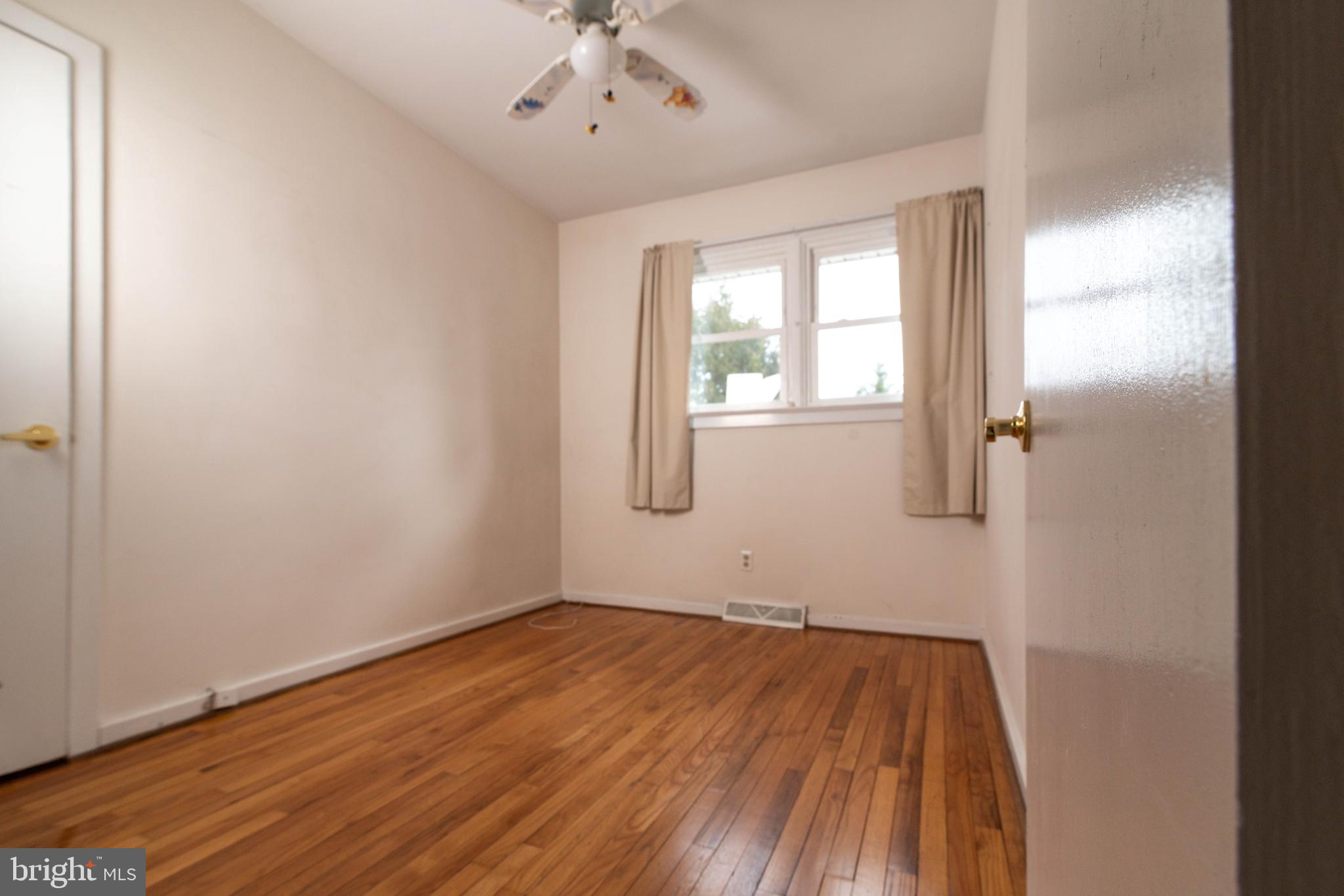 106 South Shady Retreat Road Doylestown, PA 18901 - Photo 6 of 33 wooden floor in an empty room with a window