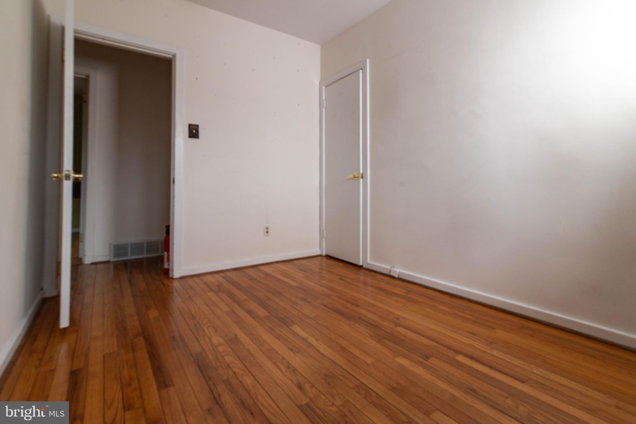 106 South Shady Retreat Road Doylestown, PA 18901 - Photo 7 of 33 a view of an empty room with wooden floor and a window