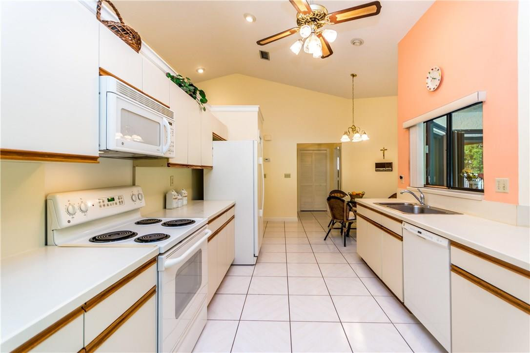 22870 Greenview Terrace Boca Raton, FL 33433 - Photo 11 of 57 a kitchen with stainless steel appliances a stove a sink and a refrigerator