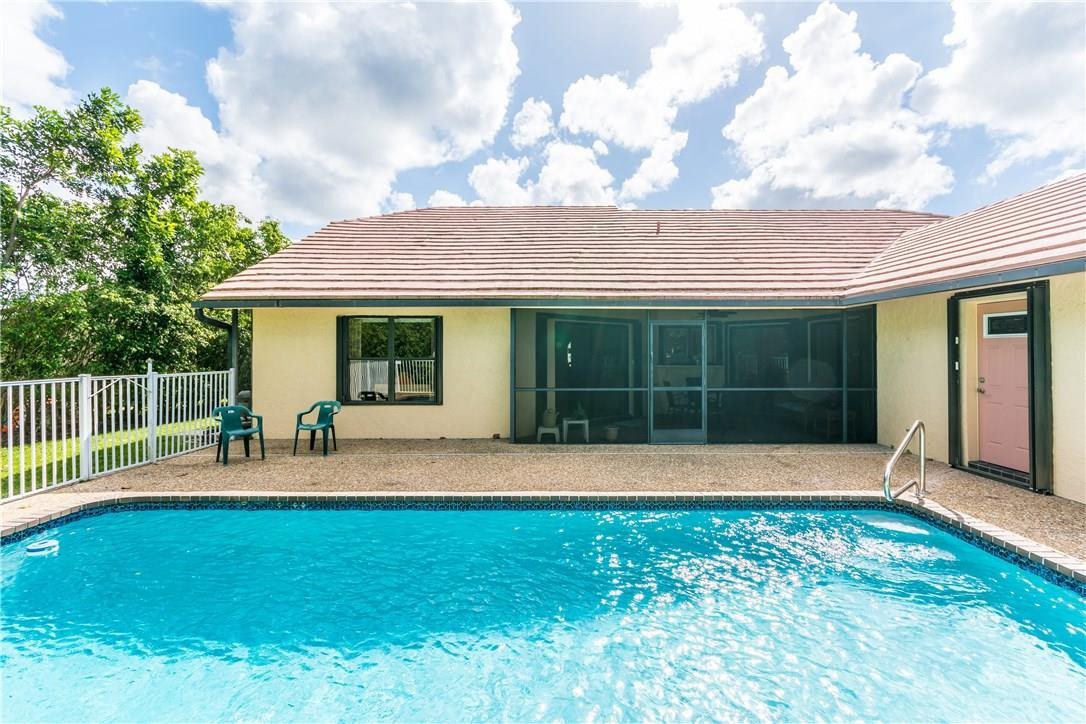 22870 Greenview Terrace Boca Raton, FL 33433 - Photo 20 of 57 a front view of house with yard and outdoor seating