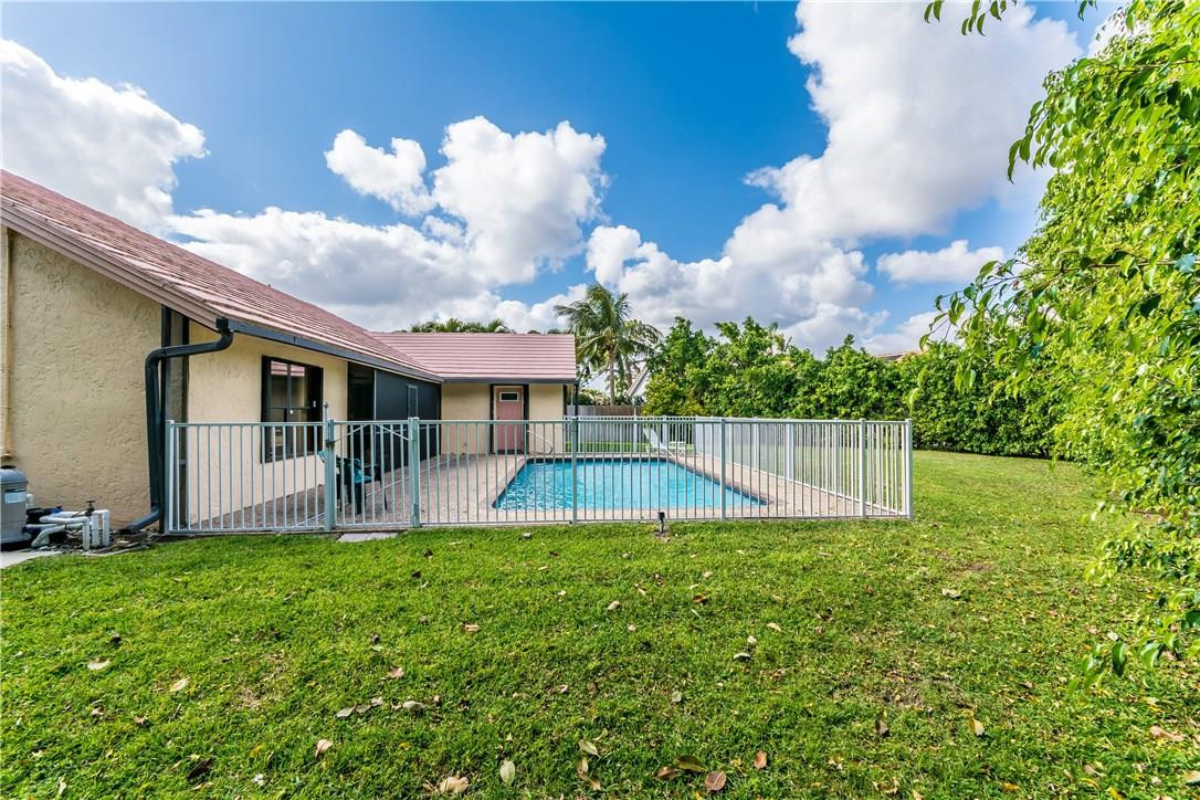 22870 Greenview Terrace Boca Raton, FL 33433 - Photo 21 of 57 a view of a house with a yard and a garden