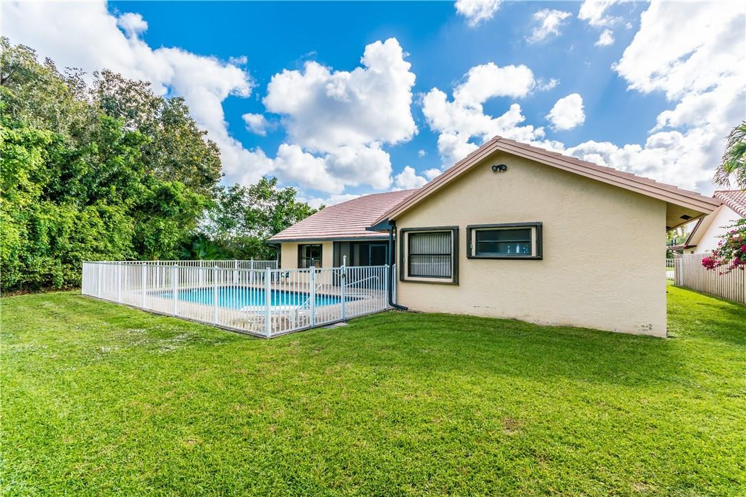 22870 Greenview Terrace Boca Raton, FL 33433 - Photo 23 of 57 a view of a house with a backyard