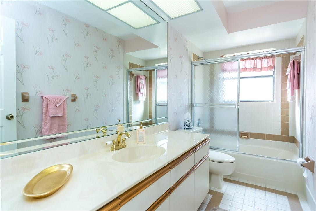 22870 Greenview Terrace Boca Raton, FL 33433 - Photo 29 of 57 a bathroom with a granite countertop sink mirror vanity and toilet