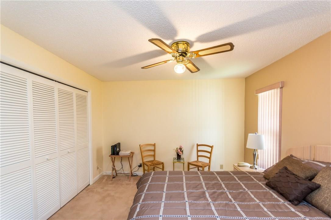 22870 Greenview Terrace Boca Raton, FL 33433 - Photo 31 of 57 a bedroom with a large bed and a window