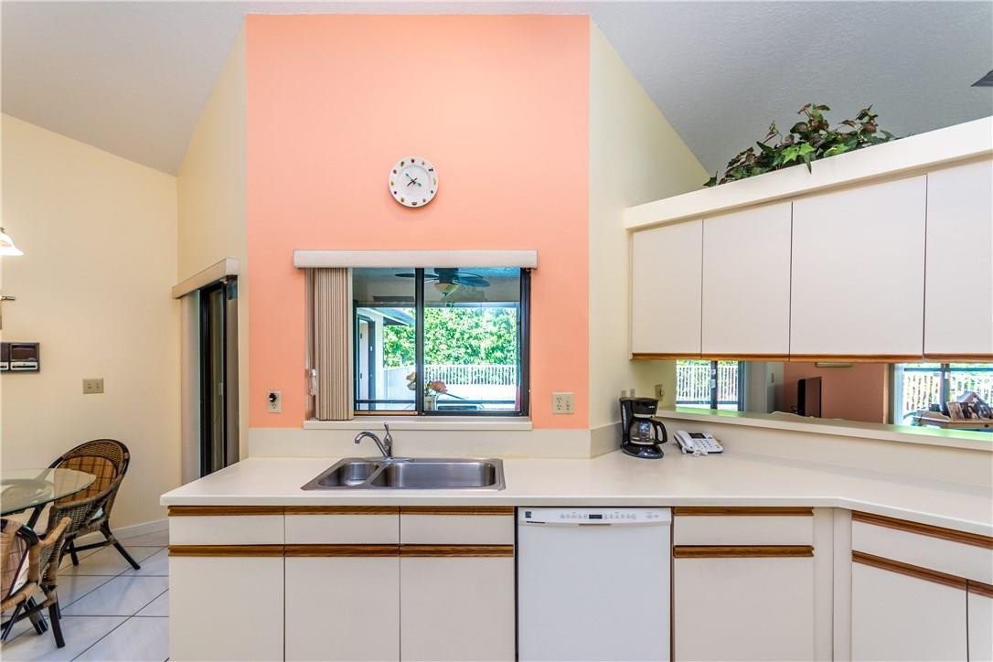 22870 Greenview Terrace Boca Raton, FL 33433 - Photo 40 of 57 a kitchen with a sink cabinets and window