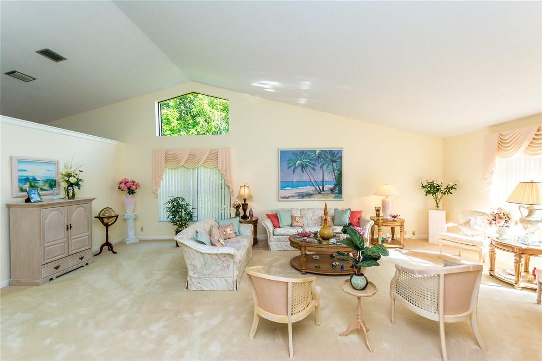 22870 Greenview Terrace Boca Raton, FL 33433 - Photo 47 of 57 a living room with furniture and paintings