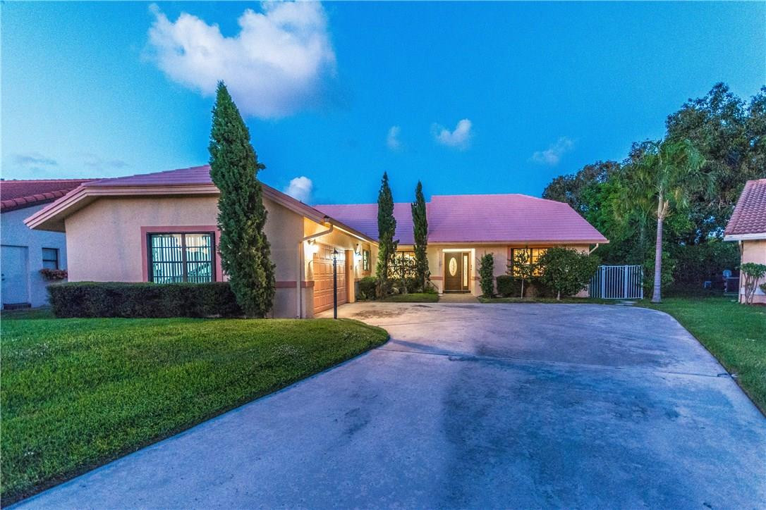 22870 Greenview Terrace Boca Raton, FL 33433 - Photo 50 of 57 a view of a house with backyard and a tree