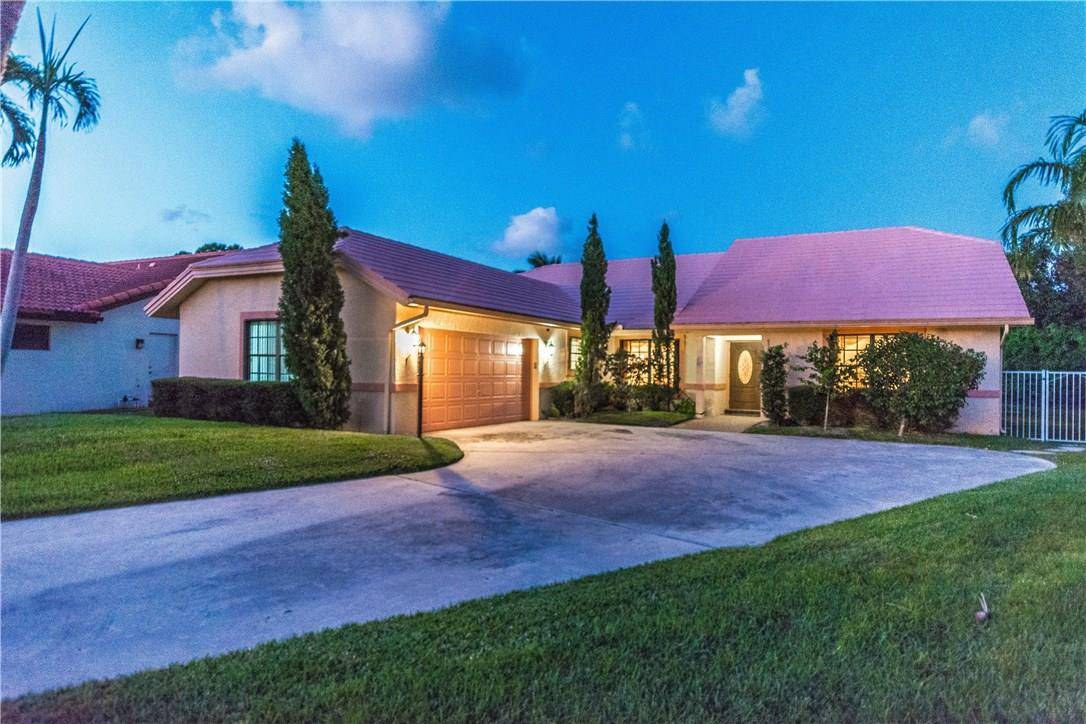 22870 Greenview Terrace Boca Raton, FL 33433 - Photo 51 of 57 a view of an house with backyard and a patio