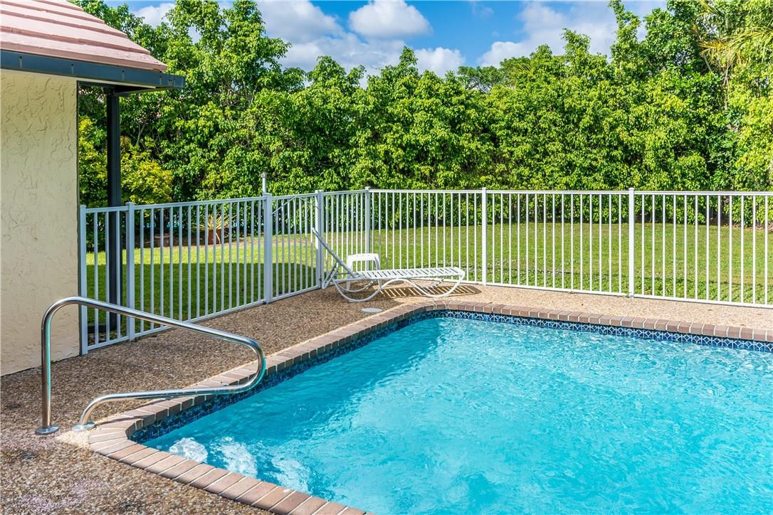 22870 Greenview Terrace Boca Raton, FL 33433 - Photo 54 of 57 a view of a deck with a chair and table