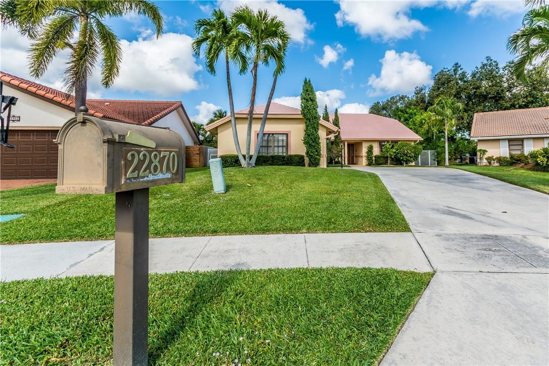 22870 Greenview Terrace Boca Raton, FL 33433 - Photo 55 of 57 a front view of a house with garden