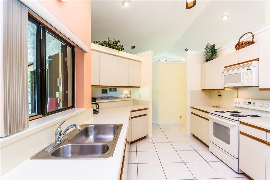 22870 Greenview Terrace Boca Raton, FL 33433 - Photo 10 of 57 a kitchen with stainless steel appliances granite countertop a sink and cabinets