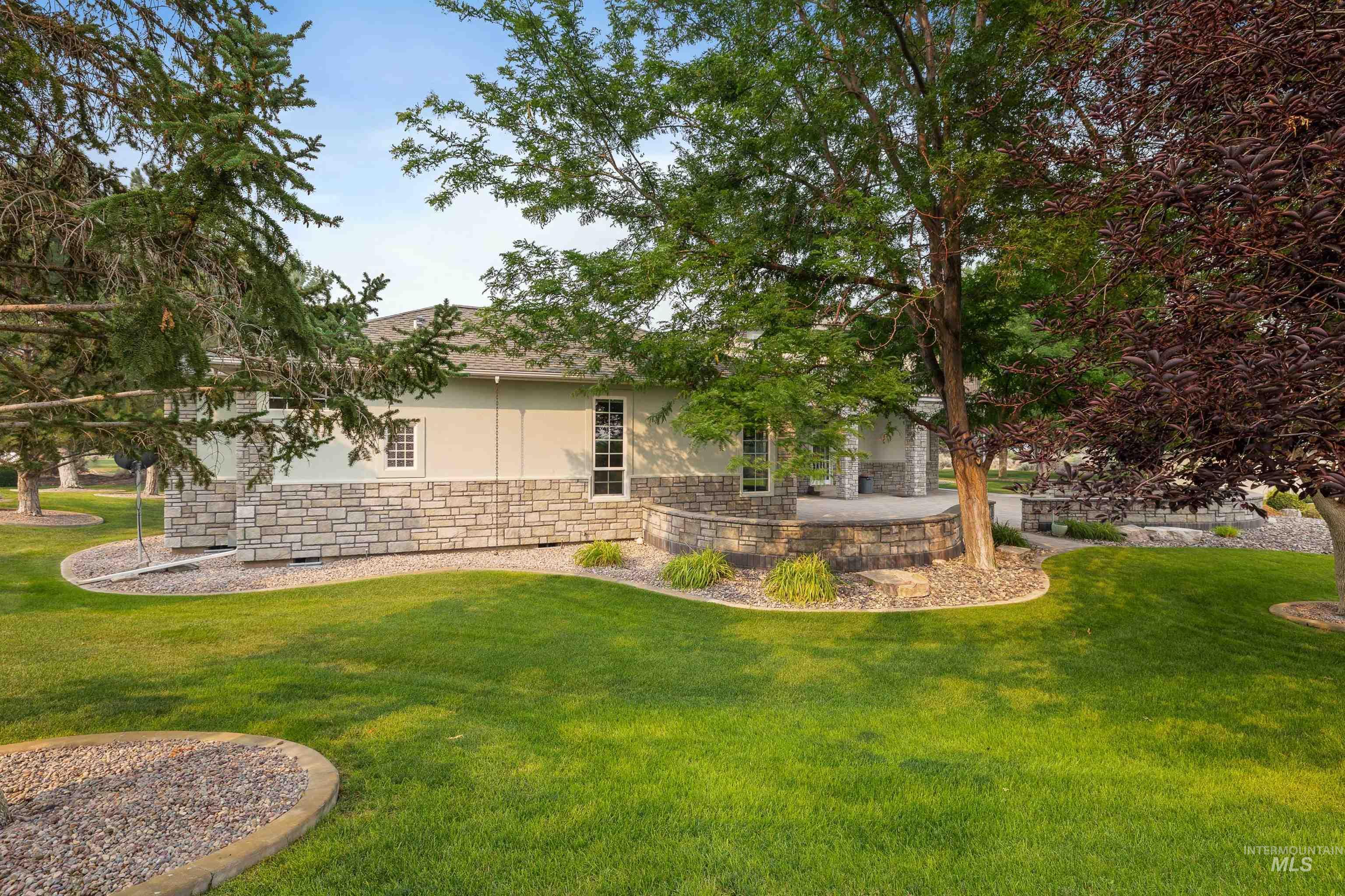 3404 Ridge Line Drive Kimberly, ID 83341 - Photo 45 of 50 Spacious lawn area with established trees and layered landscaping