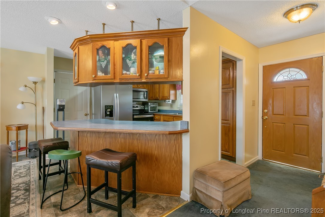 6042 Elliott Bridge Road Linden, NC 28356 - Photo 15 of 47 a bedroom with a bed and a table