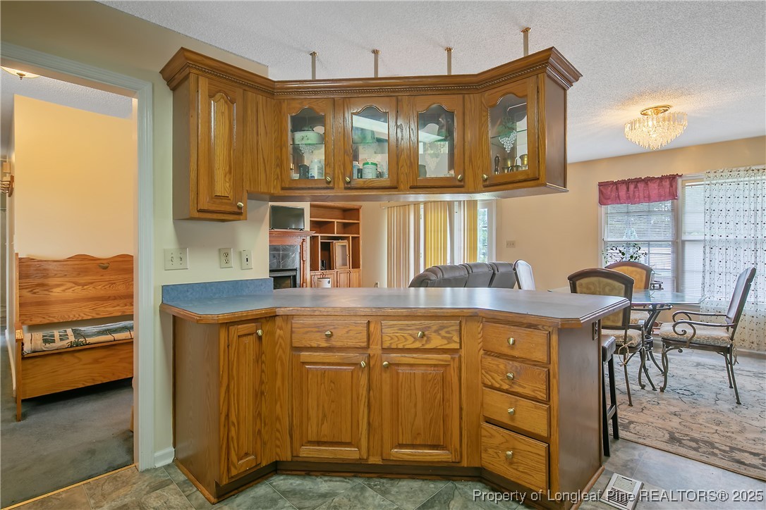 6042 Elliott Bridge Road Linden, NC 28356 - Photo 18 of 47 a kitchen with cabinets and outdoor view