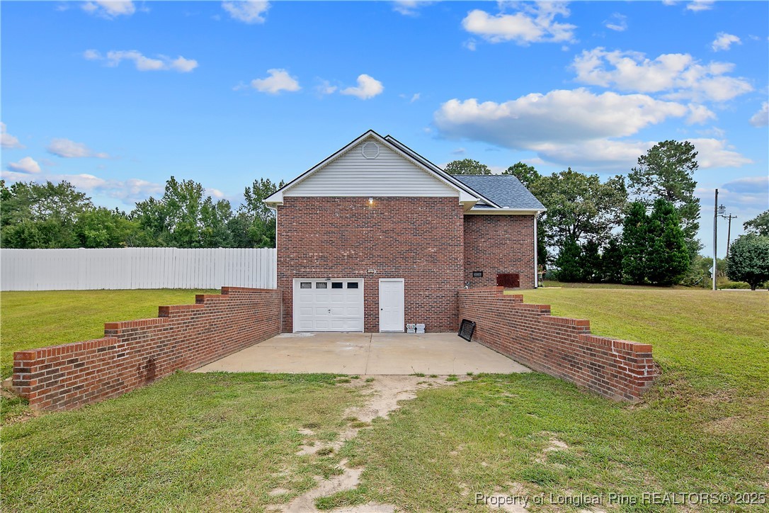 6042 Elliott Bridge Road Linden, NC 28356 - Photo 3 of 47 a view of a house with a backyard