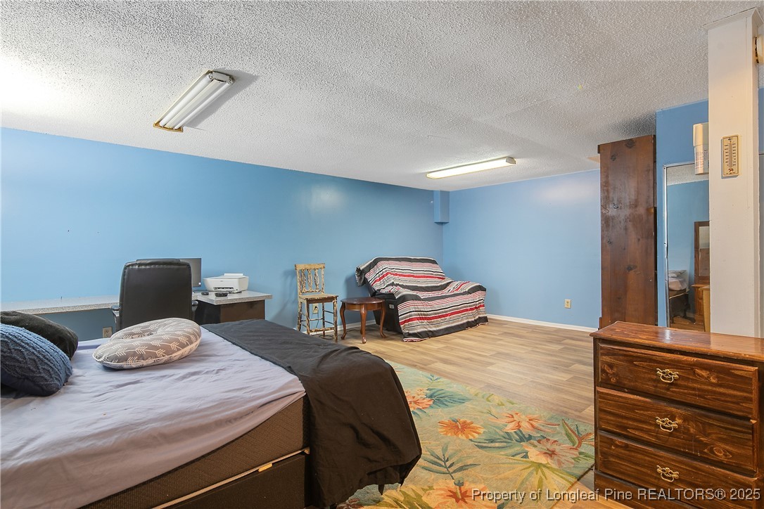 6042 Elliott Bridge Road Linden, NC 28356 - Photo 38 of 47 a bedroom with two beds and painted walls