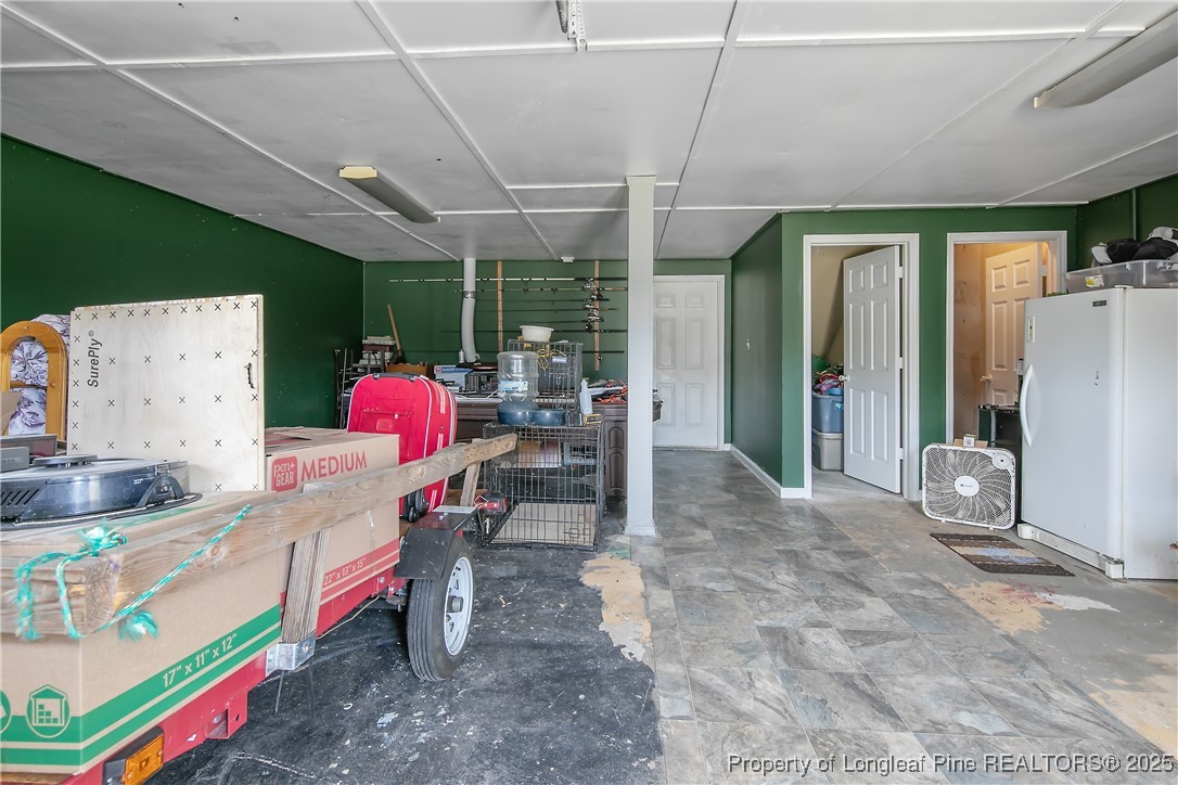 6042 Elliott Bridge Road Linden, NC 28356 - Photo 40 of 47 a kitchen with stainless steel appliances granite countertop a sink and a refrigerator