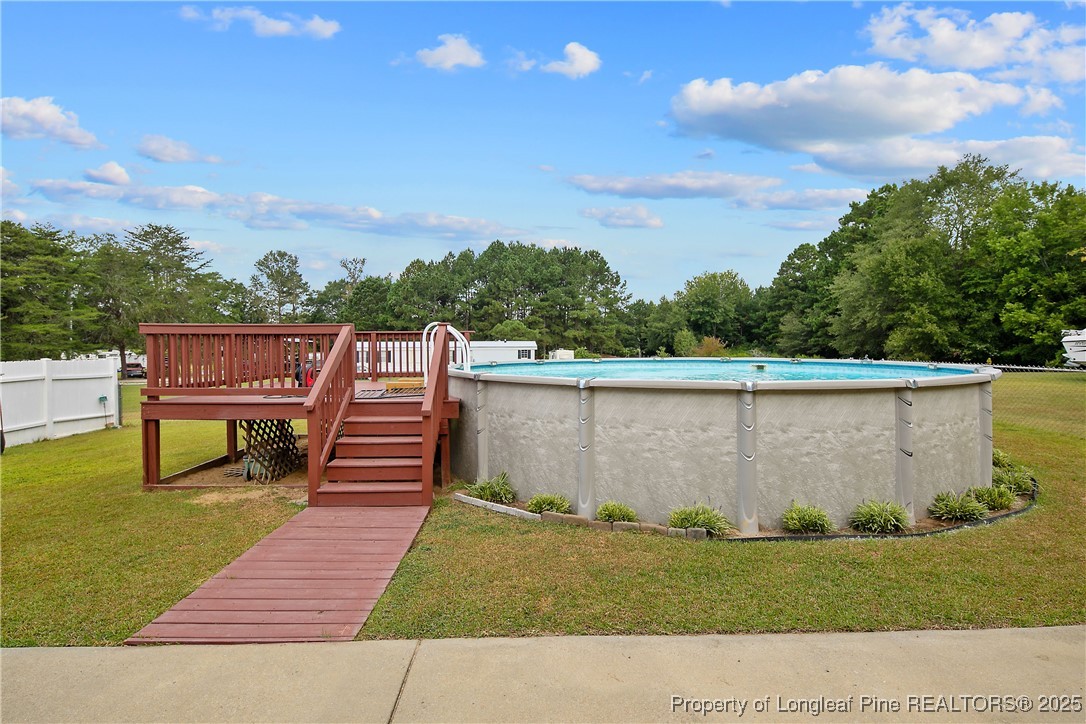 6042 Elliott Bridge Road Linden, NC 28356 - Photo 44 of 47 a view of a patio with a yard