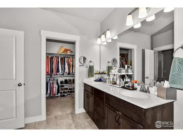 a bathroom with a sink vanity and a mirror