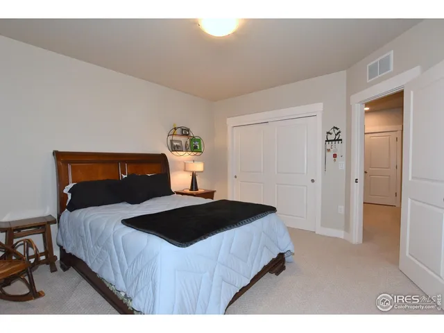 a bedroom with a bed and a table