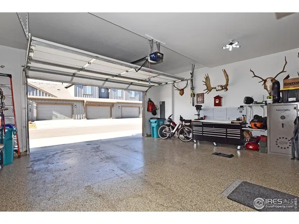 a bedroom with furniture and a flat screen tv