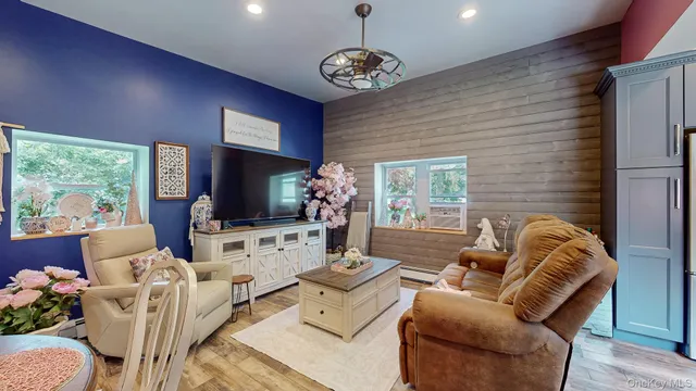 a spacious bedroom with a large bed and a potted plant