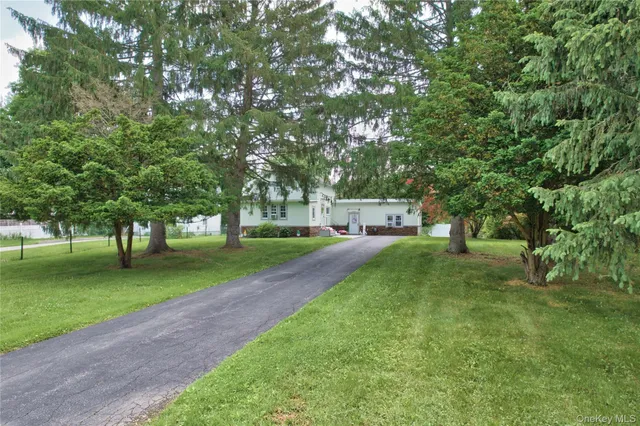 a view of a house with a big yard