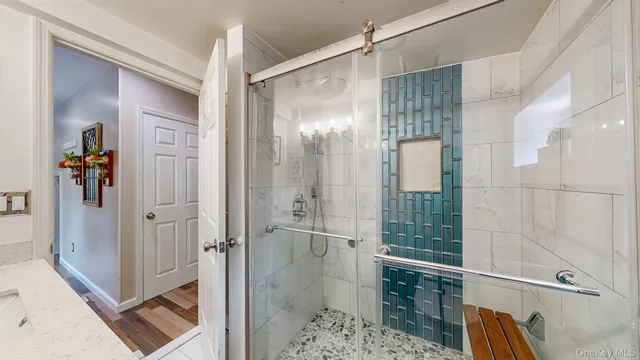 a room with lots of wooden furniture and a chandelier