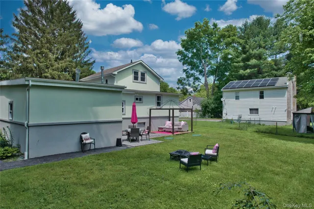 a view of a chairs in front of a house
