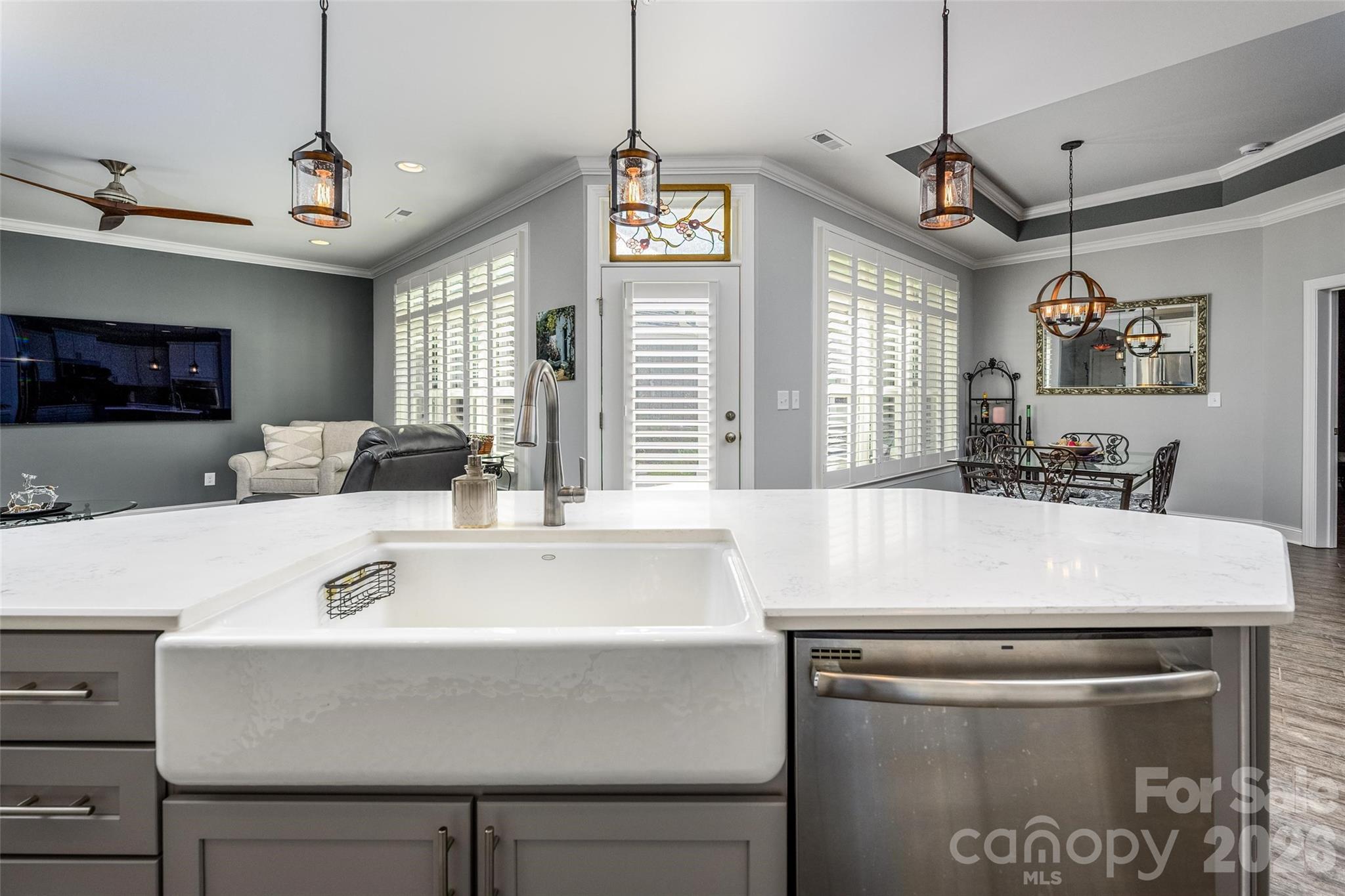 16215 Lakeside Loop Lane Cornelius, NC 28031 - Photo 20 of 48 a kitchen with a table a refrigerator and a sink