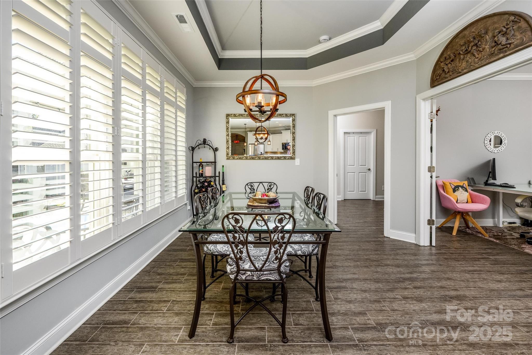 16215 Lakeside Loop Lane Cornelius, NC 28031 - Photo 23 of 48 a view of a dining room with furniture window and wooden floor
